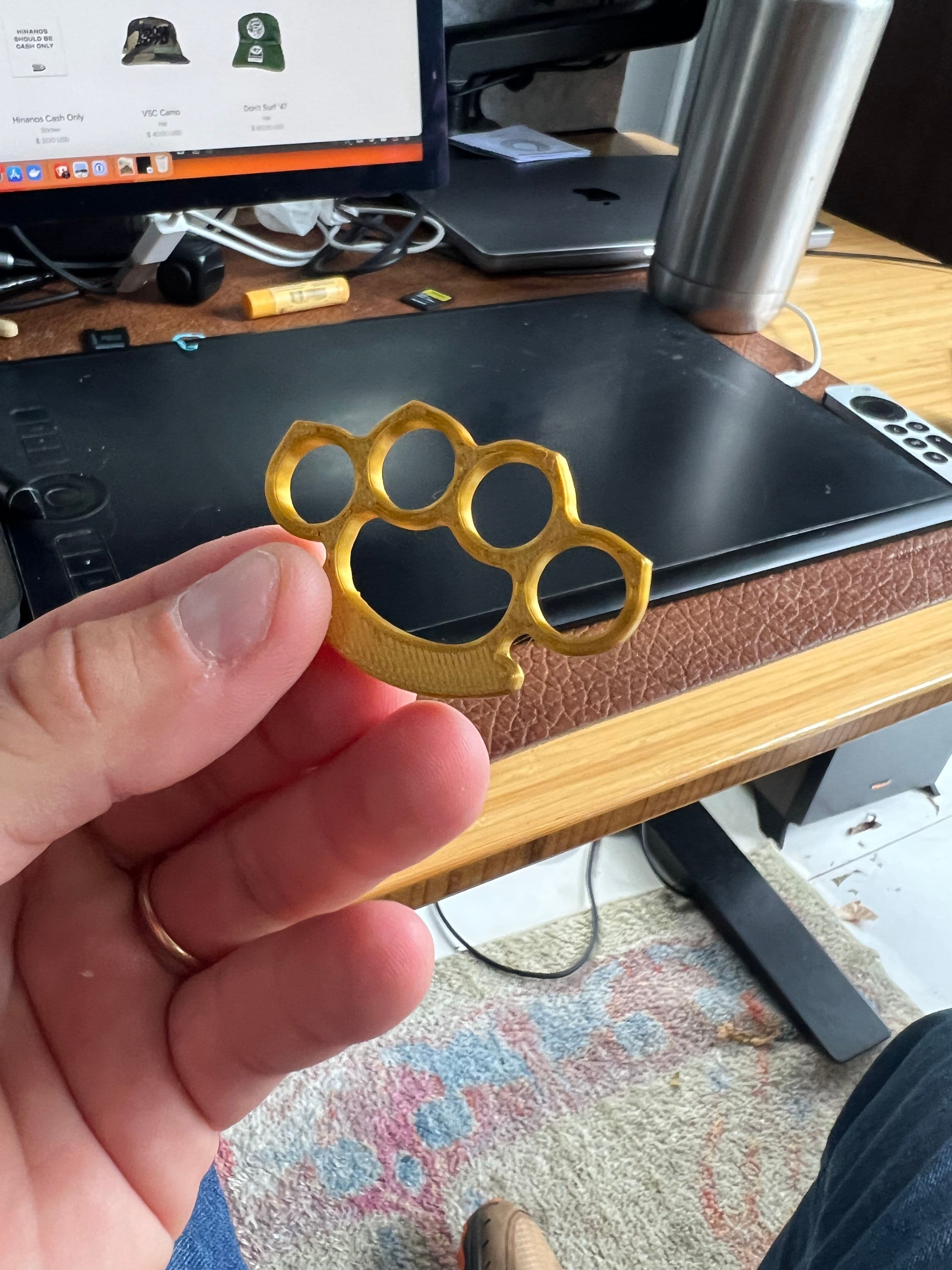Infant brass knuckles.